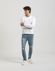 Jeans regular fit con strappi